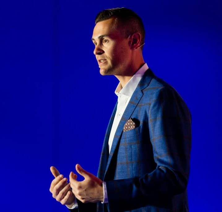 Ryan Hanley speaking on stage